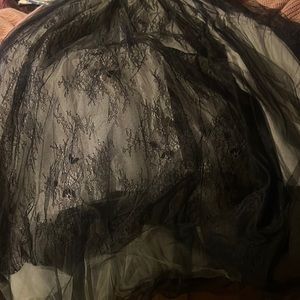 Tulle lace layered large skirt below knee length.